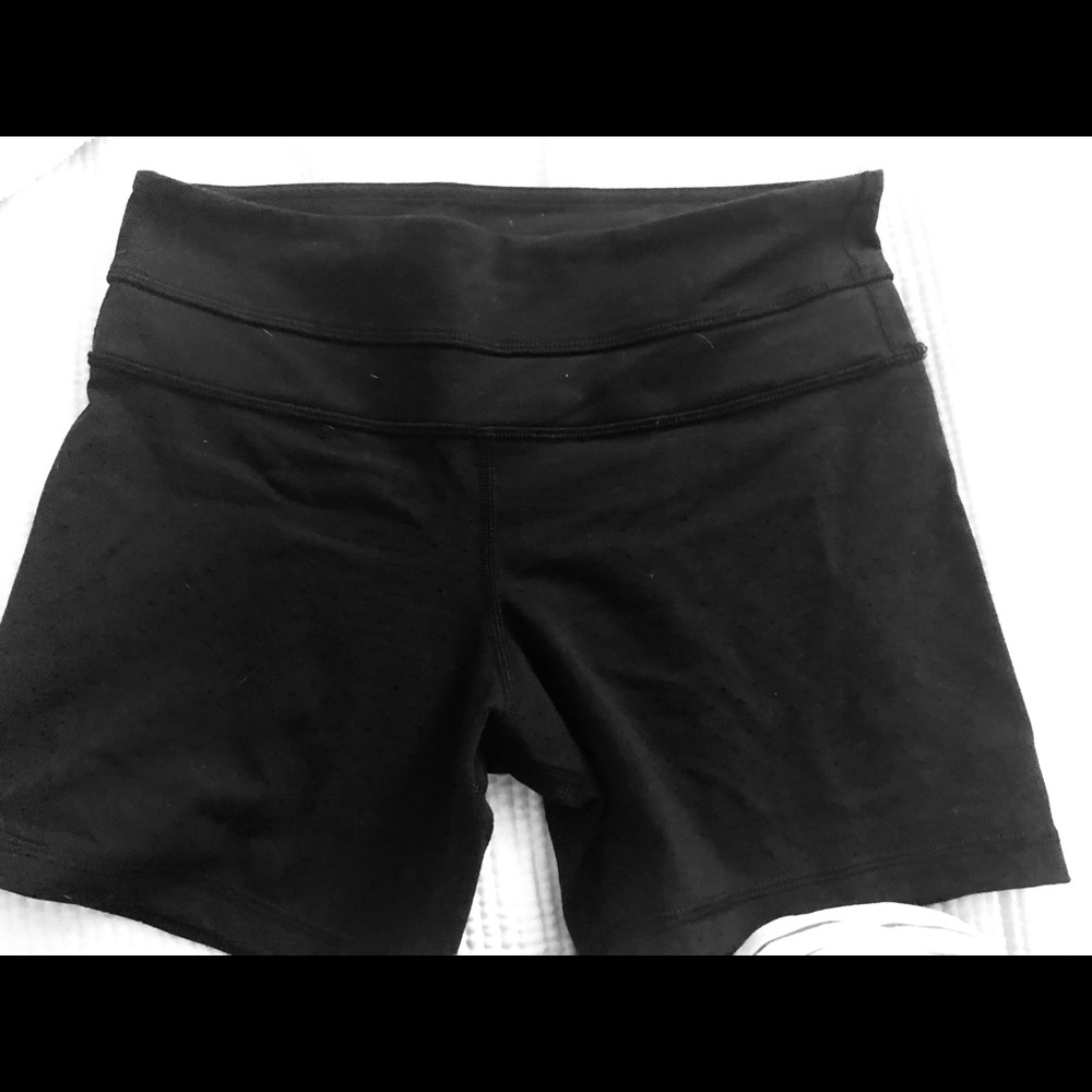 Lululemon short biker shorts with subtle meshing.